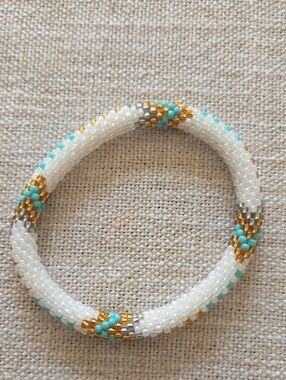 Sashka Co. White Seed Bead Bracelet with Turquoise, Gold And Gray Accent.